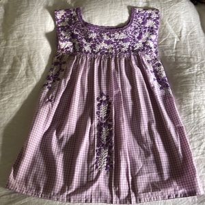 Mi Golondrina embroidered purple gingham top.